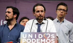 Podemos (We Can) party leader Pablo Iglesias (C), now running under the coalition Unidos Podemos (Together We Can), gives remarks on results in Spain's general election in Madrid, Spain, June 26, 2016. REUTERS/Andrea Comas